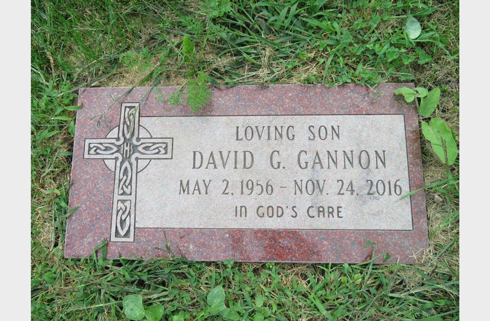 Red granite marker with Celtic cross