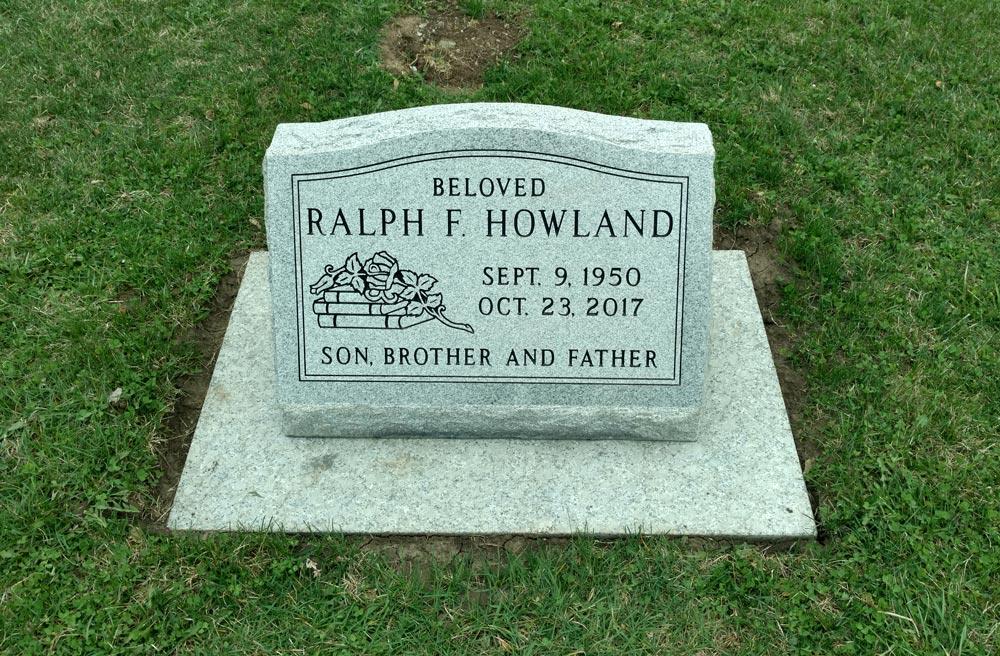 Grey granite single slant with books and rose