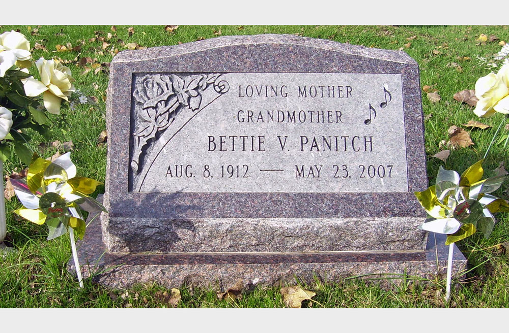 Mahogany colored slant with deep cut roses musical notes and rock pitched nosing