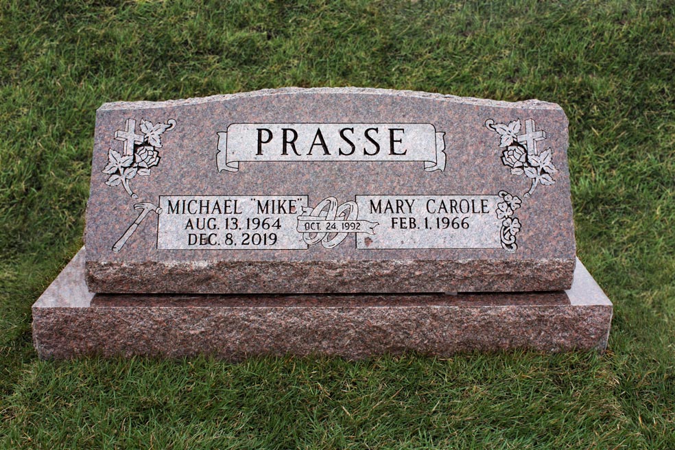 Rose colored companion slant on base with cross, roses and wedding rings