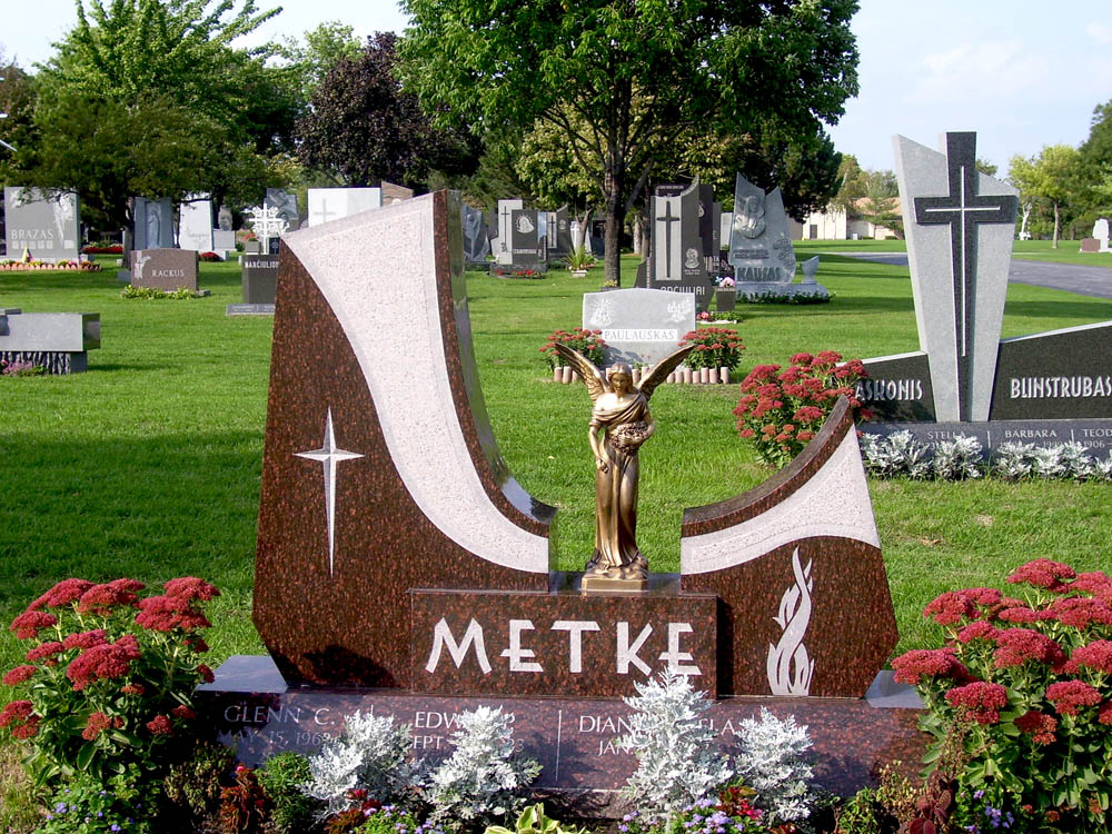 Family monument in brown granite with bronze angel sculpture