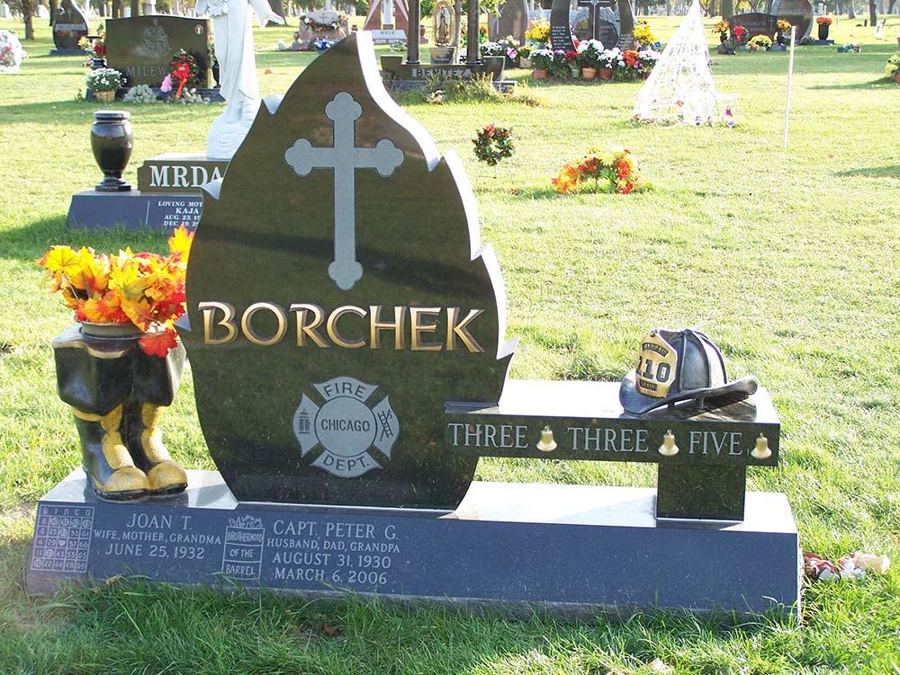 Bench monument with bronze letters and Christian cross