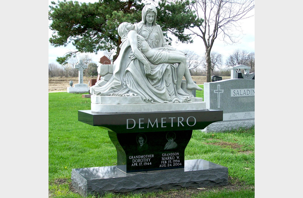 Family monument with pietá sculpture and hand-etched portraits