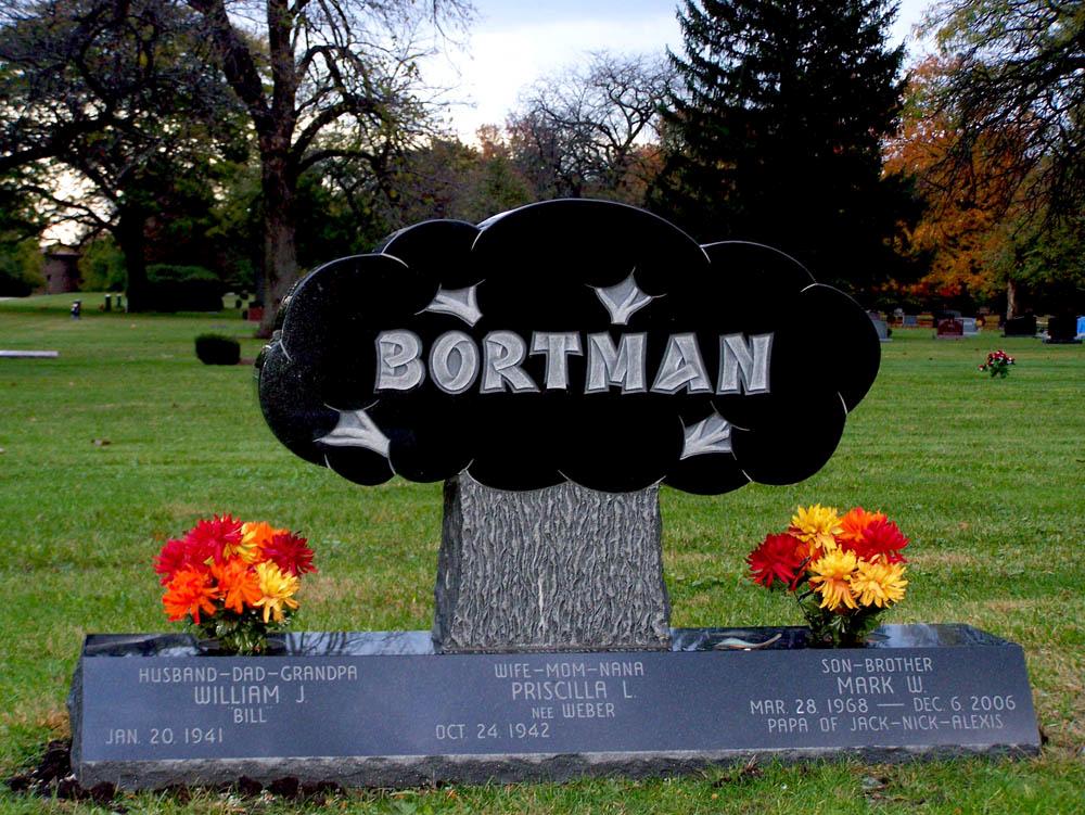 Family monument shaped like a tree and with built in vases