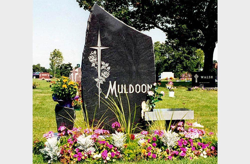 Vertical family monument with bench and v-tooled cross